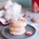 a plate with a stack of peppermint crinkle cookies.