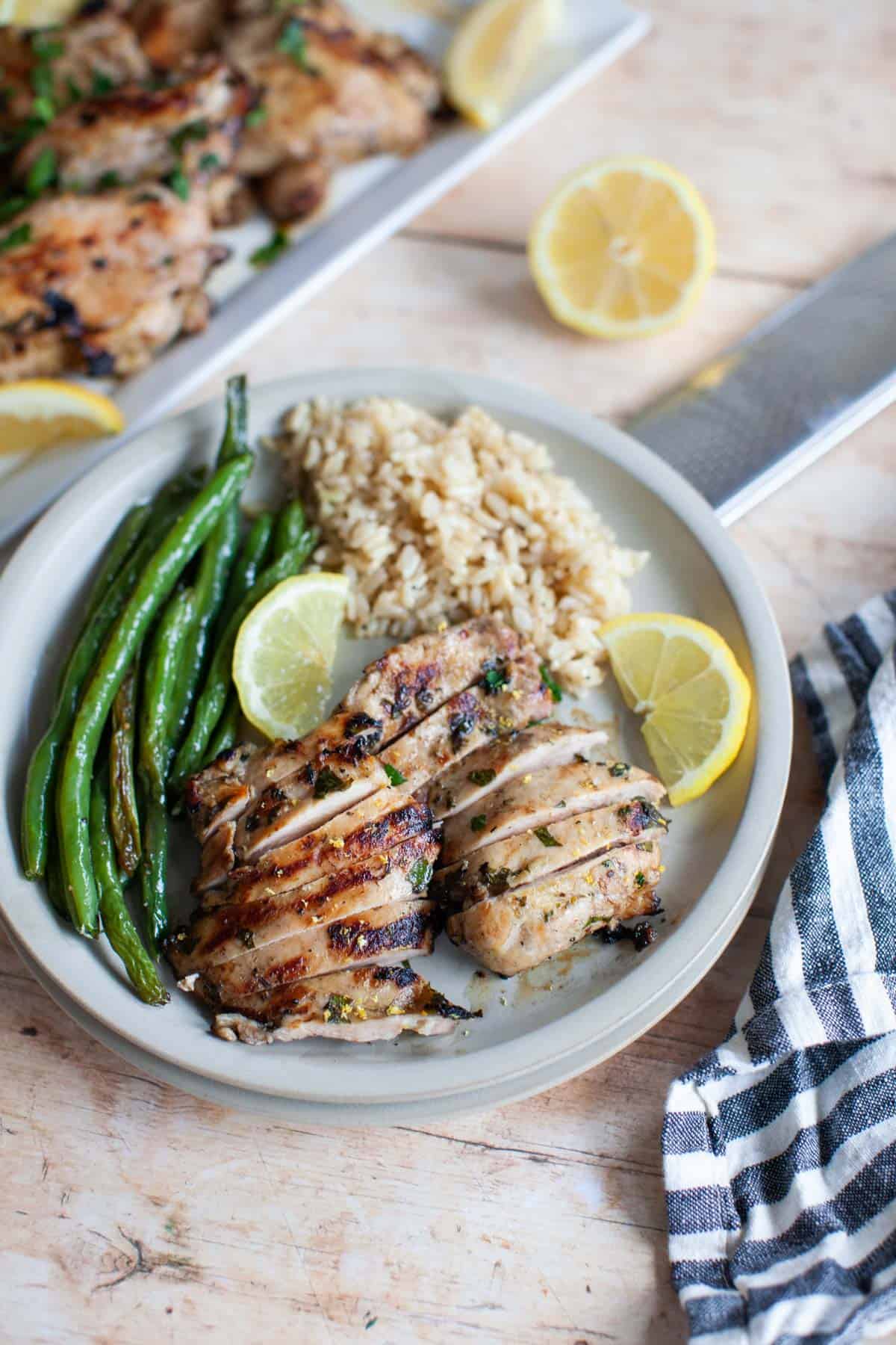 cut chicken thighs on a plate