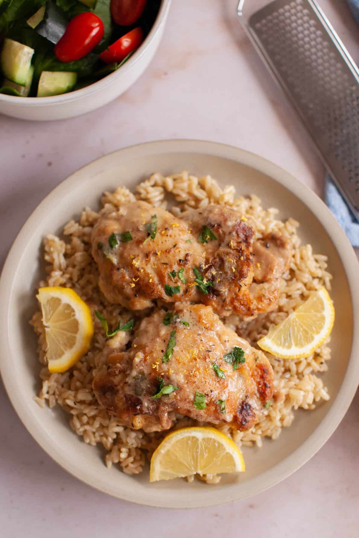 rice and lemon chicken ready to eat in a bowl.
