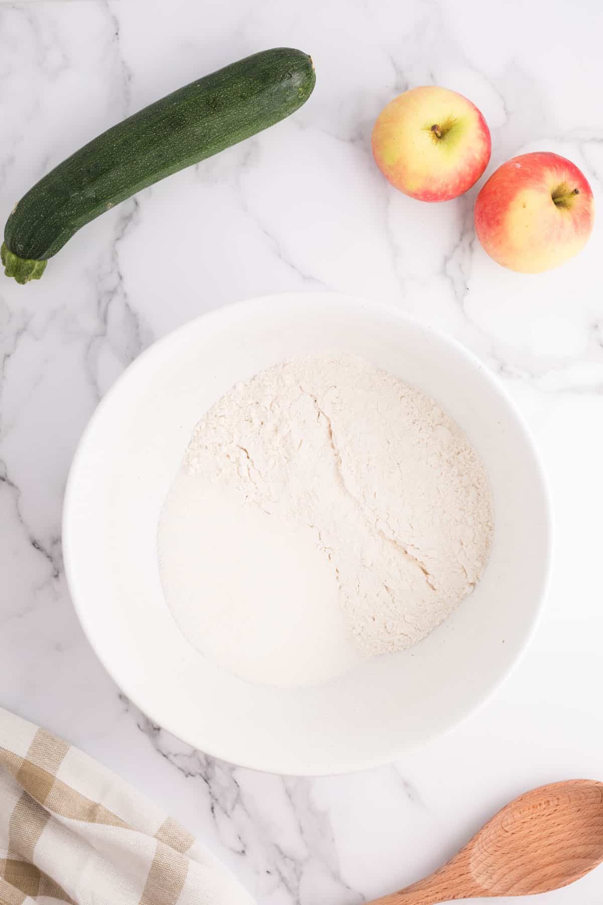 Overhead photo of self-rising flour self-rising flour and sugar in a bowl.