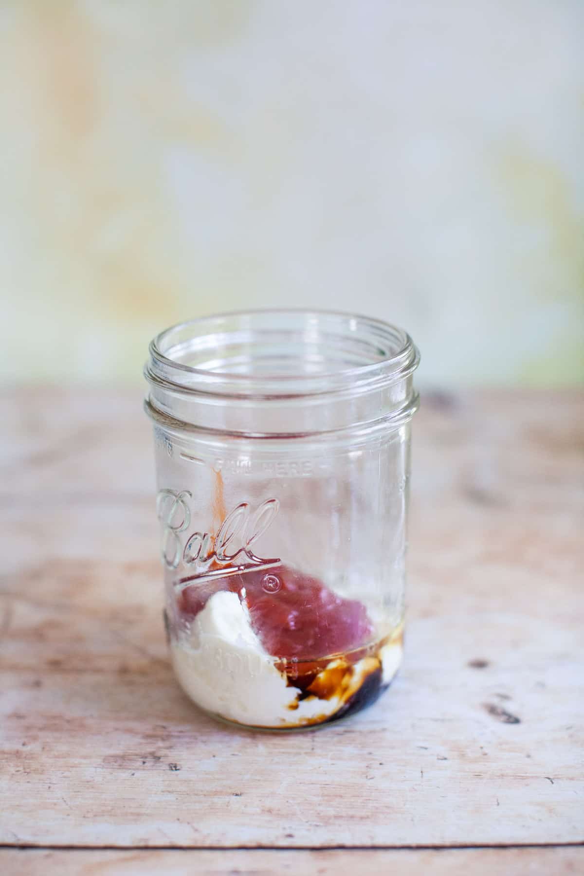 Mayo, ketchup, coconut aminos, and lemon juice in a mason jar.