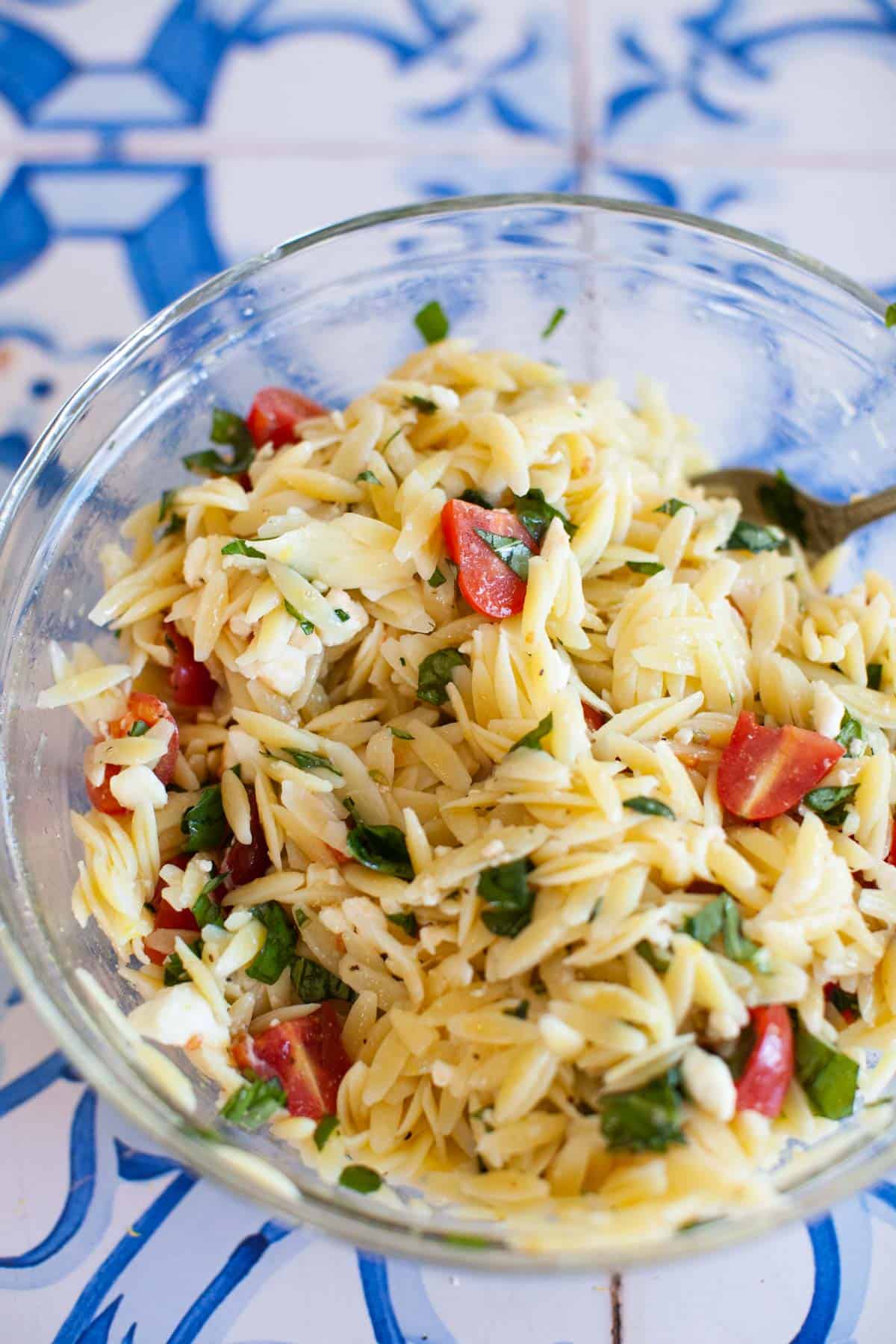 Basil, feta, and tomatoes mixed with orzo.