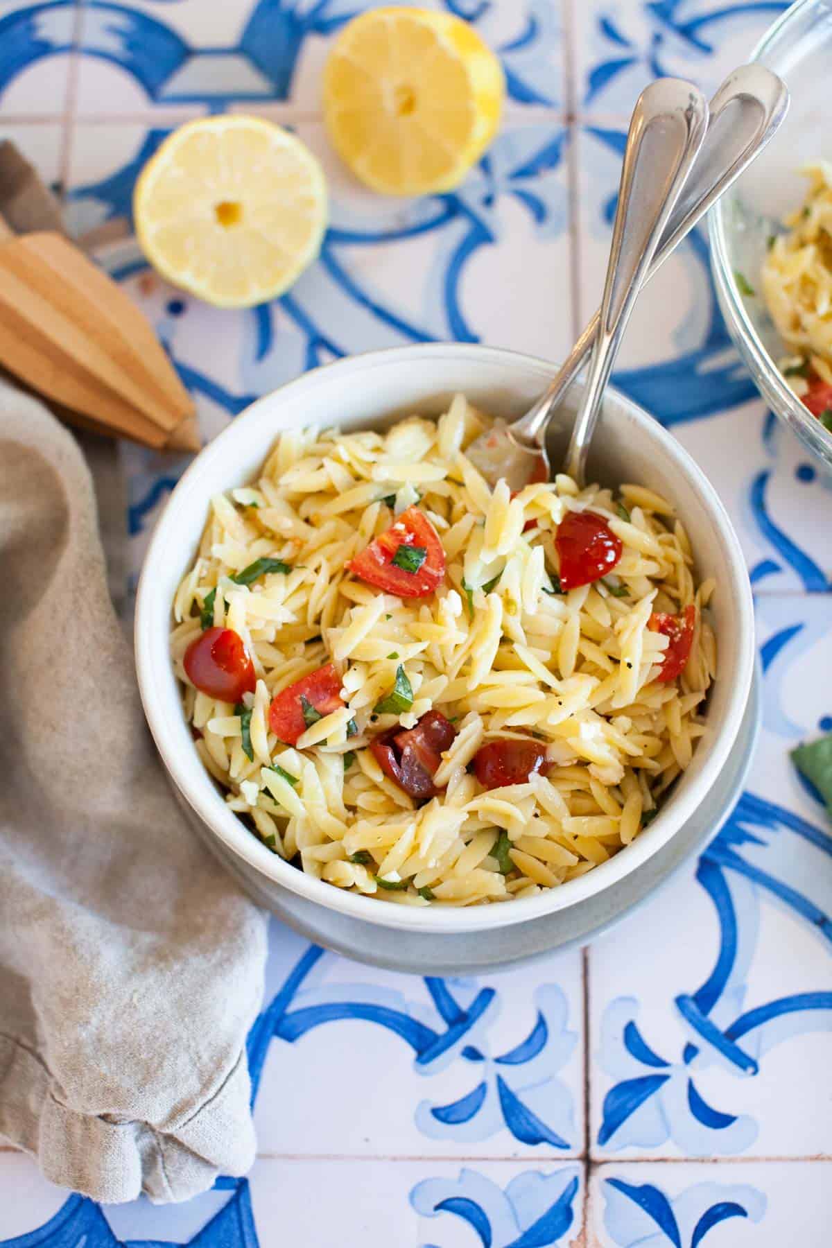 Lemon orzo pasta in a bowl on countertop.