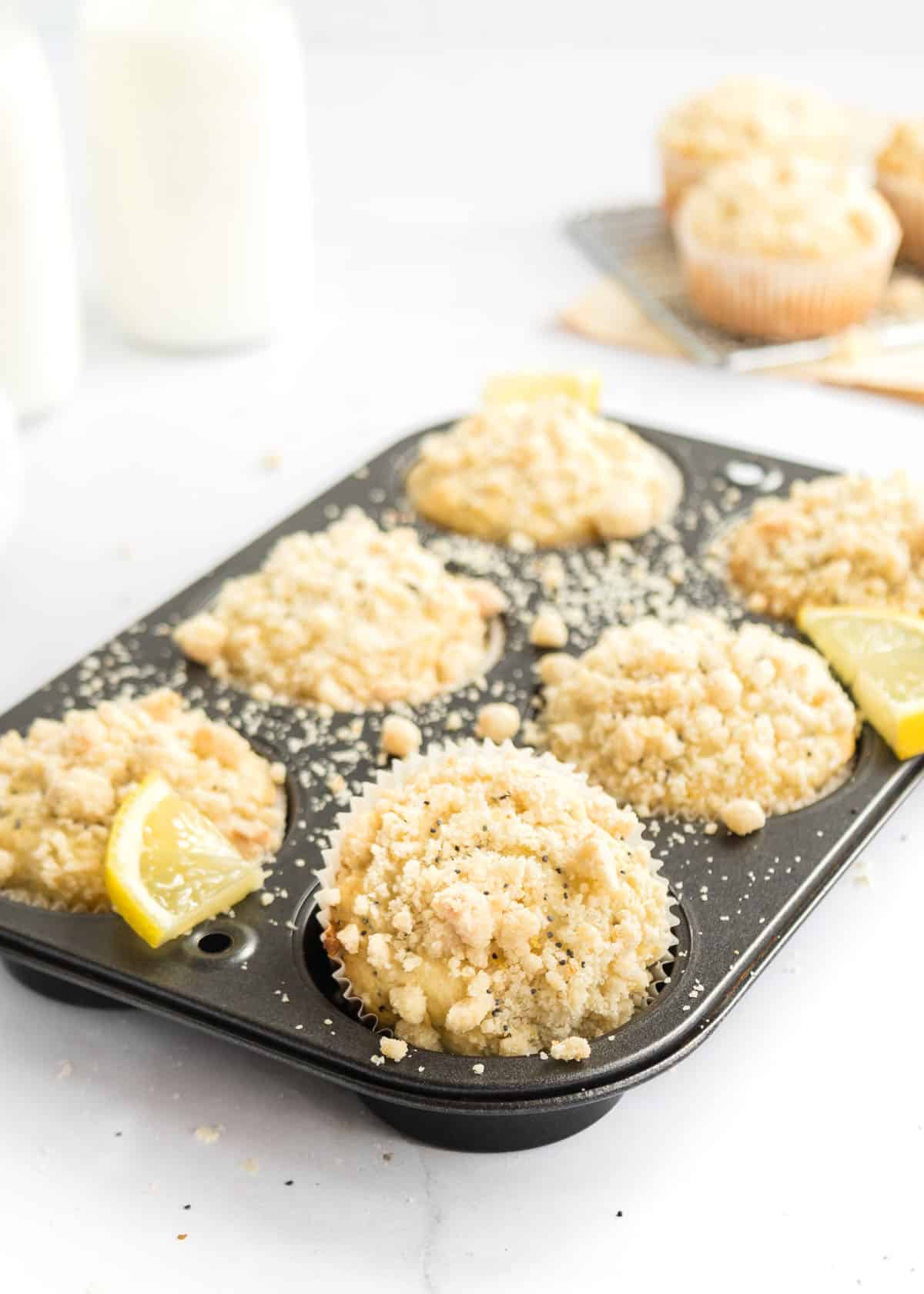 Medium photo of lemon poppy seed muffins in the lined muffin tin.