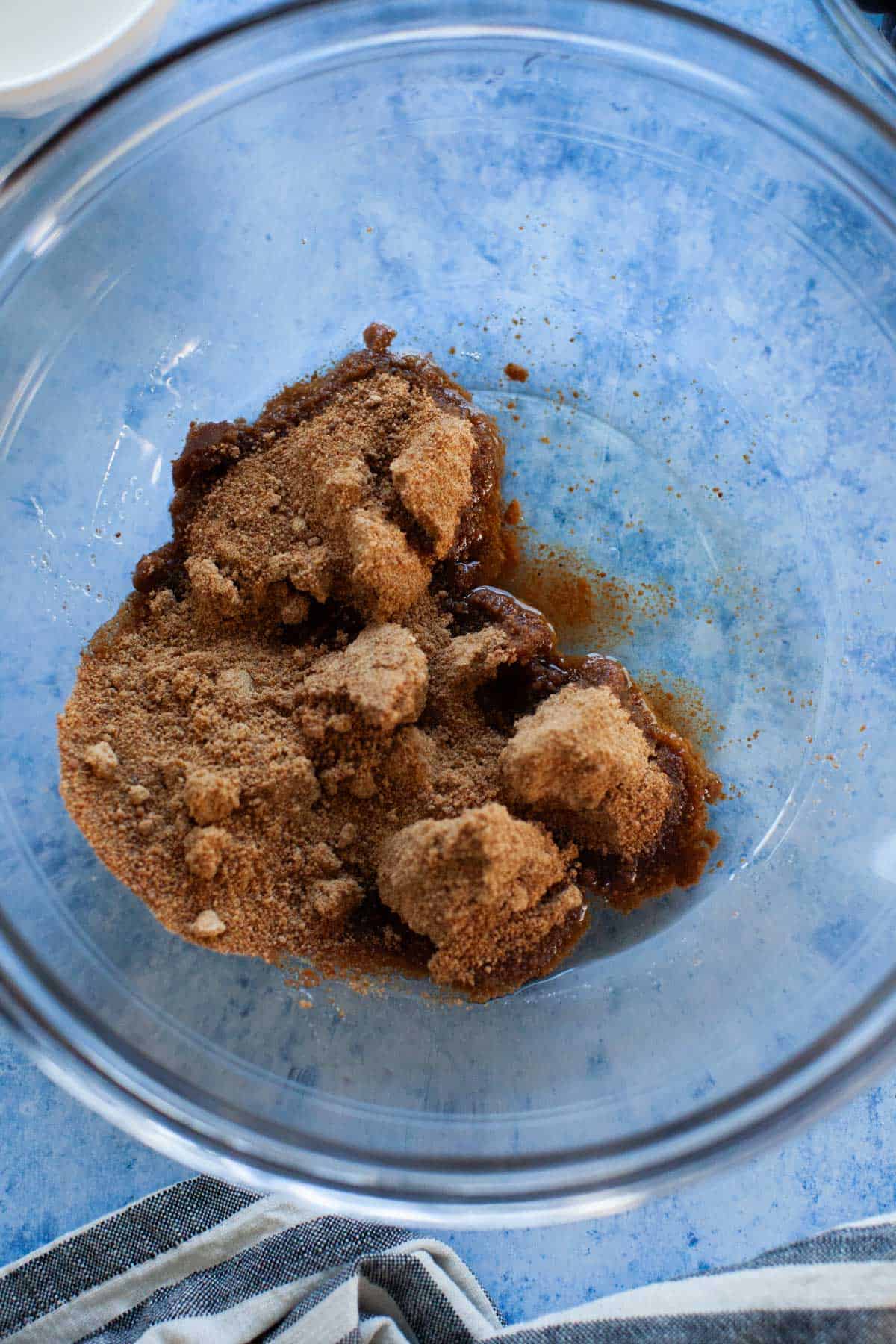 Coconut sugar and vanilla in a glass mixing bowl.