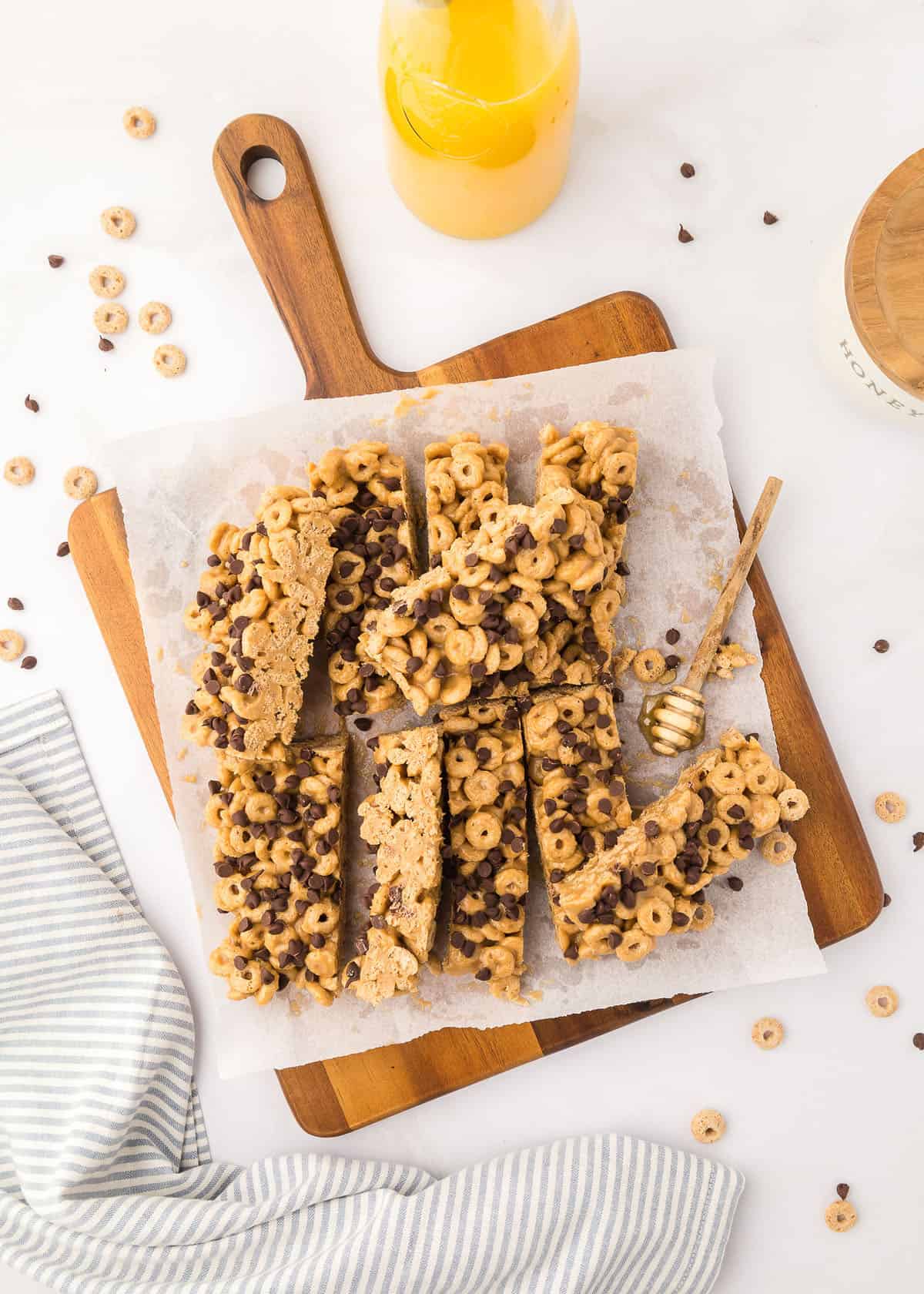 Star shaped honey coated cereal in a white bowl and wooden