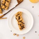Overhead photo of cereal bar on a small, white plate.