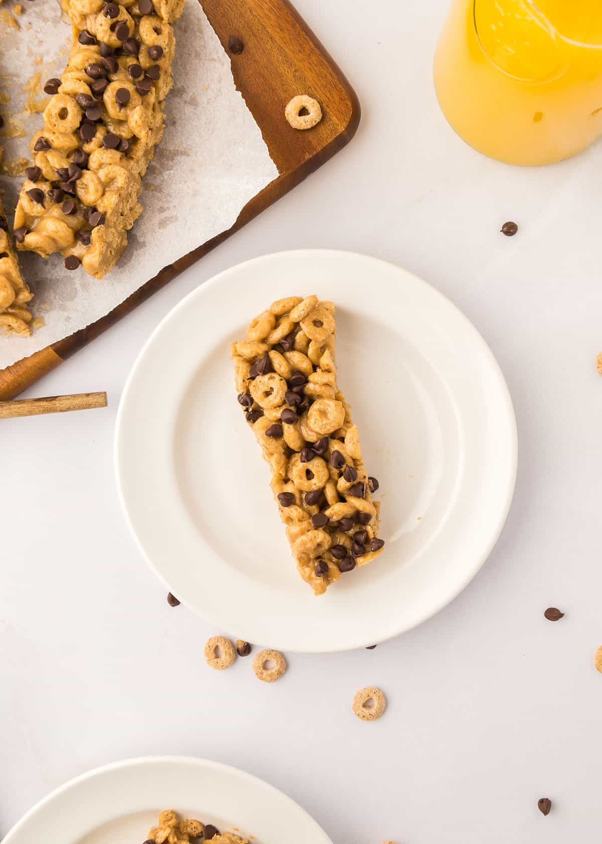 Overhead photo of cereal bar on a small, white plate.