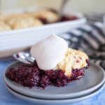 Coconut cream on top of blueberry cobbler.
