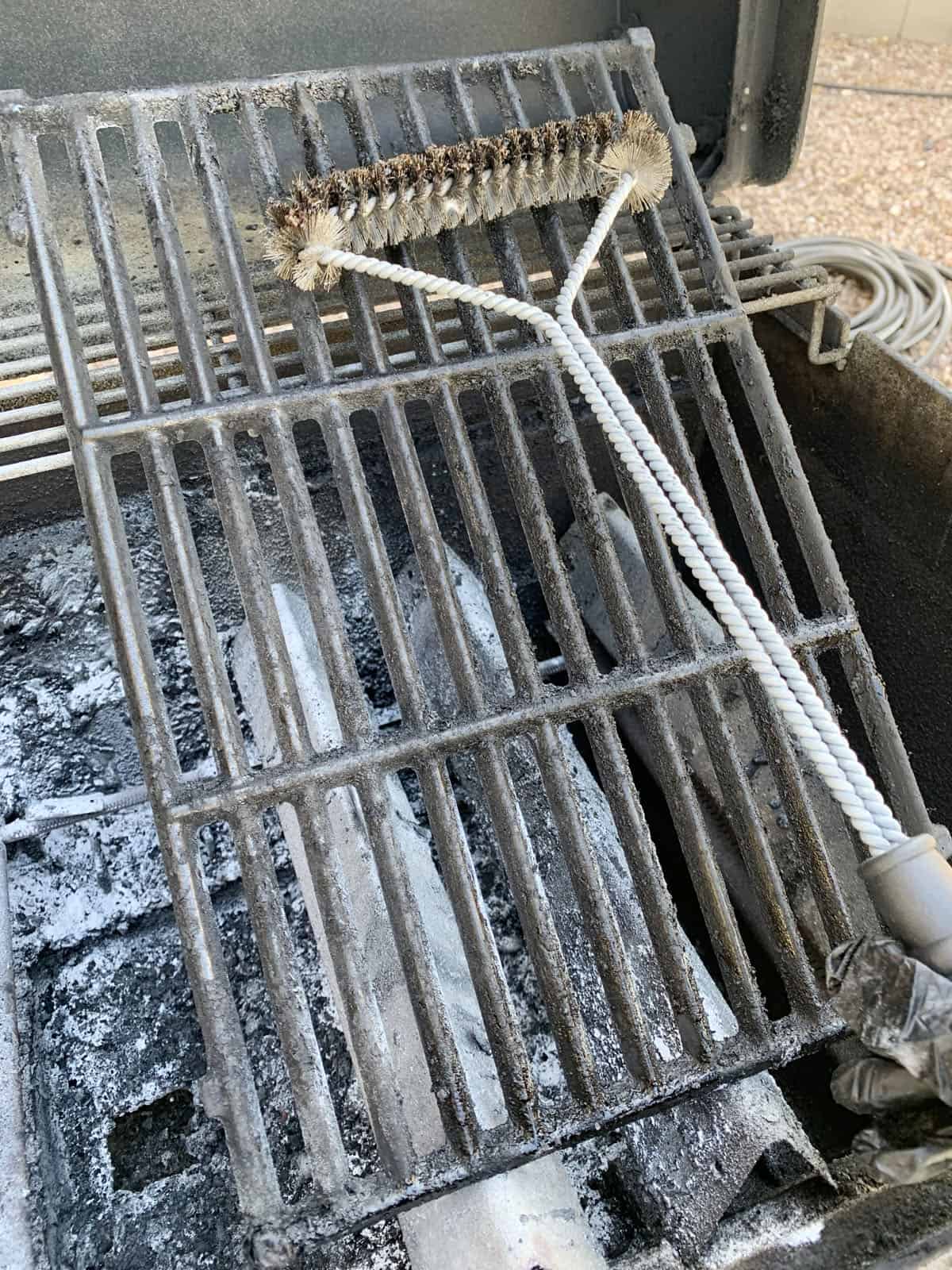 Cleaning grill grates with wire brush