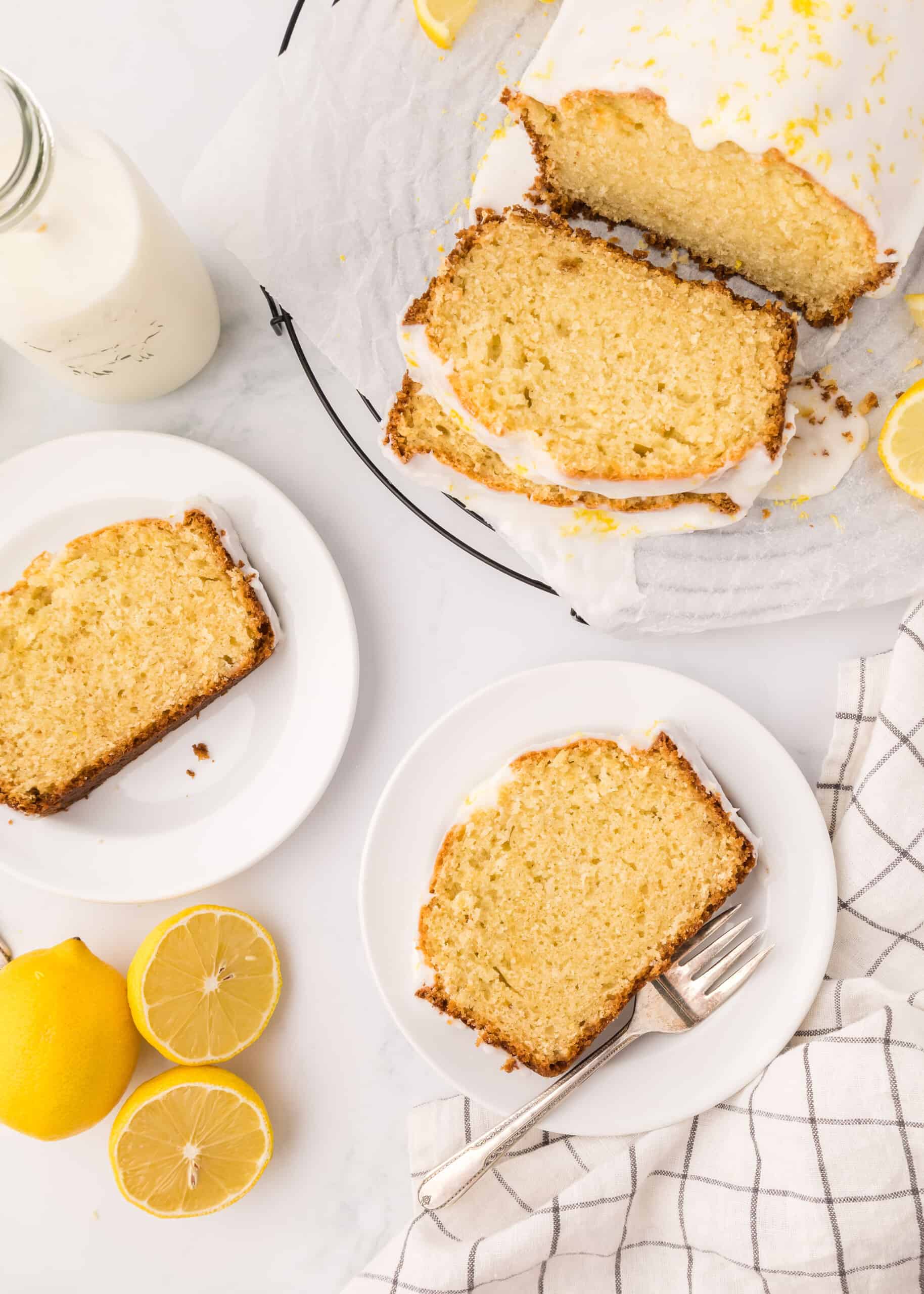 Overhead photos of two slices of lemon loaf on small, white plates.