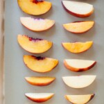 sliced peaches on a tray.