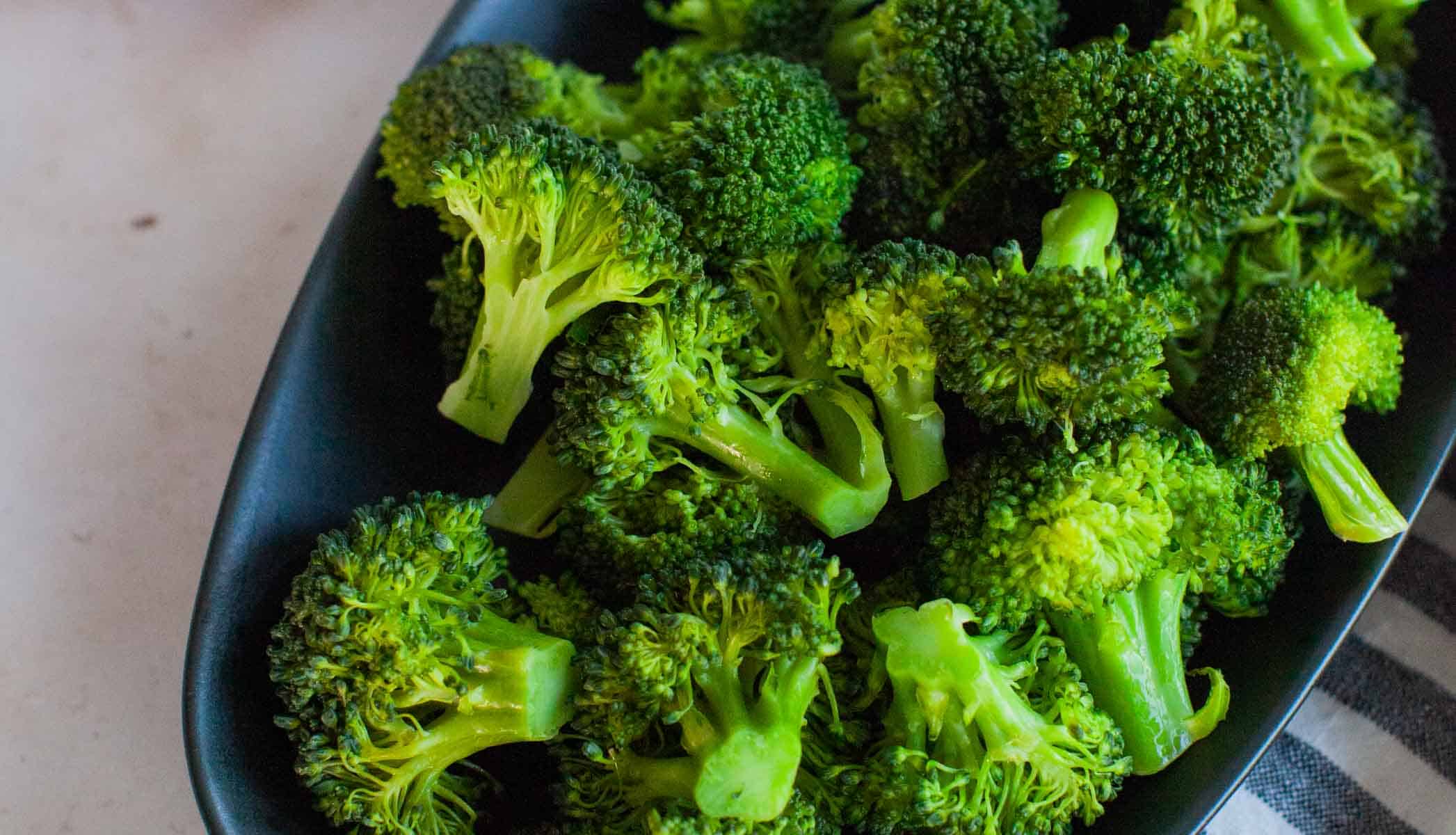 Steamed broccoli in a serving dish.