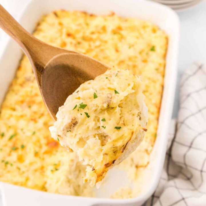 a tray of apple muffins in white wrappers
