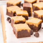 Chocolate peanut butter fudge brownies on a cutting board.