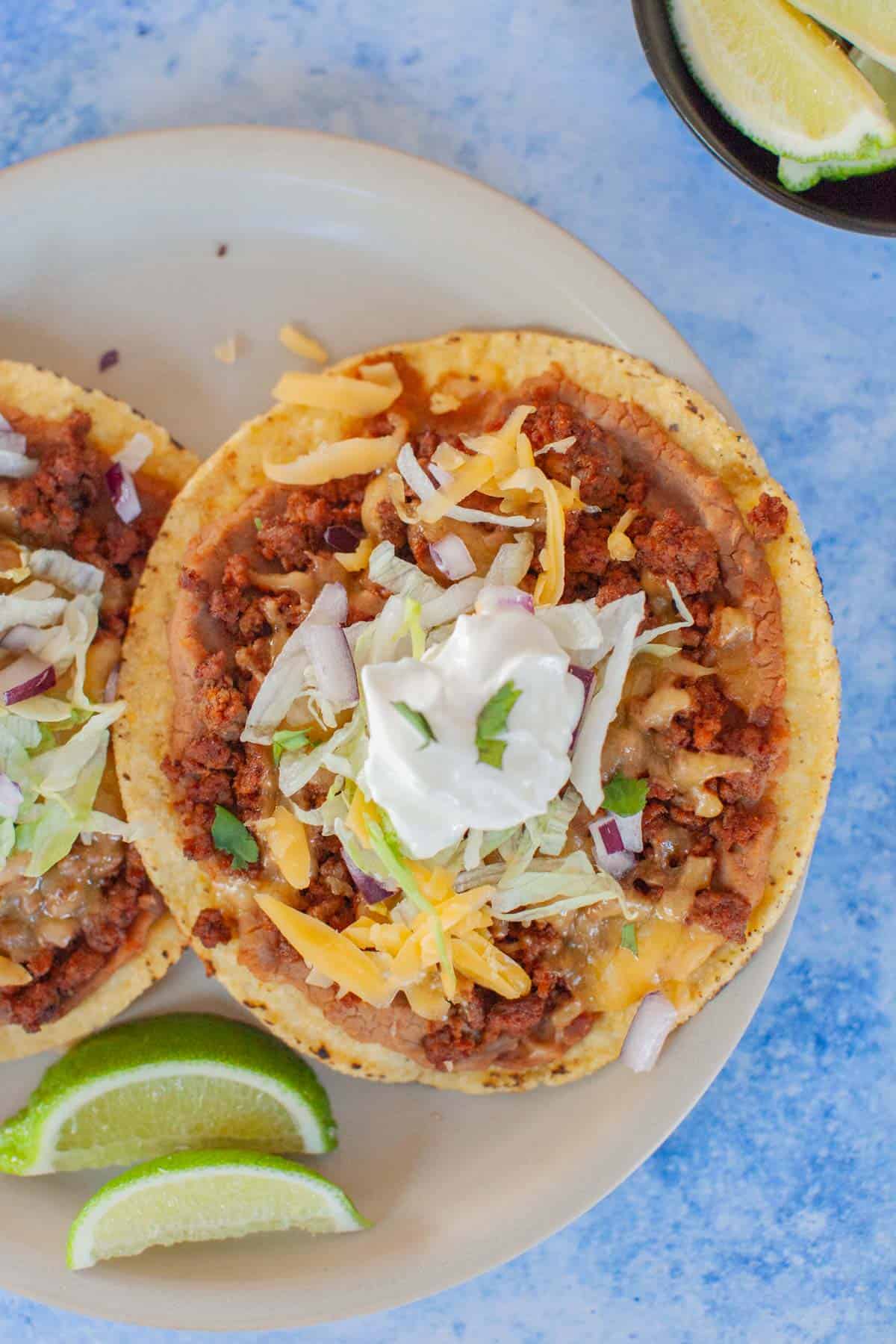 Mexican tostadas on a gray plate.