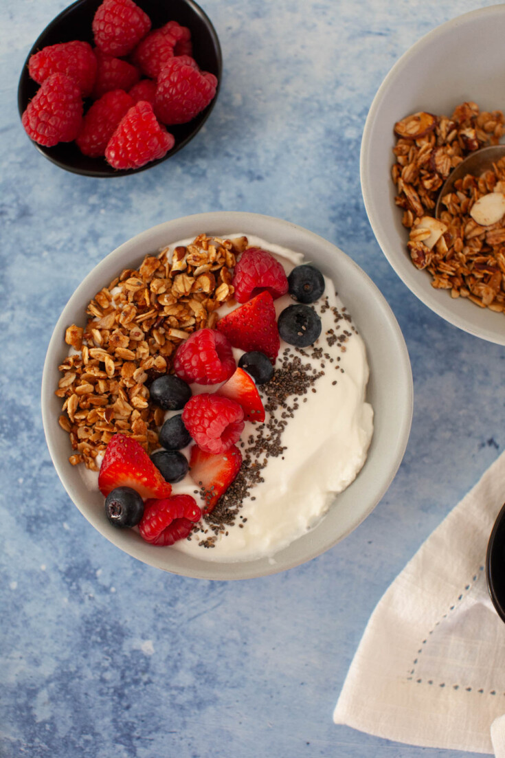 Yogurt bowl with mixed berries and granola.