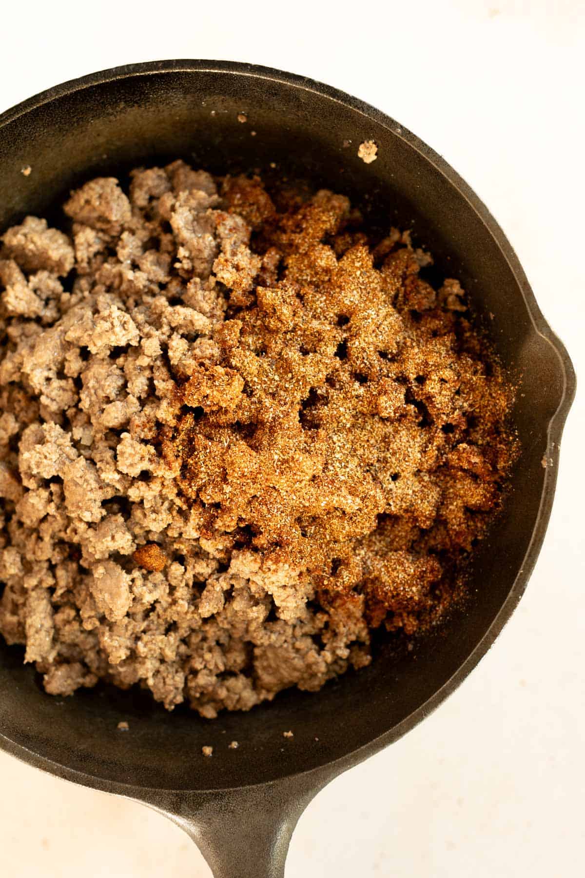 A skillet filled with ground beef and spices.