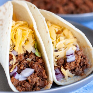 Ground beef tacos in flour tortillas.
