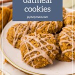 A plate of pumpkin oatmeal cookies drizzled with icing, infused with the rich flavor of pumpkin creamer. A text box above reads "pumpkin oatmeal cookies" with the website joyfullymad.com.