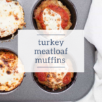 A muffin tray with savory turkey meatloaf muffins, each topped with rich tomato sauce and a layer of melted cheese, is elegantly presented on a light background.