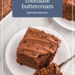 A slice of chocolate cake with chocolate buttercream sits on a white plate beside a comforting bowl of chicken wild rice casserole, with a forkful already tempting you.