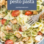 A delightful bowl of chicken pesto pasta featuring bowtie noodles, juicy cherry tomatoes, and a handy fork ready for twirling.