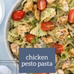 A delightful bowl of chicken pesto pasta garnished with vibrant cherry tomatoes. Text reads, "chicken pesto pasta.