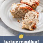 Two turkey meatloaf muffins on a white plate, one cut in half to show the inside. Text at the bottom reads, "turkey meatloaf muffins.