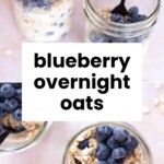 Three glass jars filled with overnight oats topped with fresh blueberries and black spoons, displayed on a light surface.