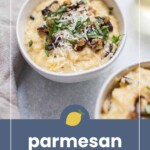 A bowl of creamy parmesan polenta topped with grated cheese, sautéed mushrooms, and fresh herbs, with another partial bowl visible beside it.