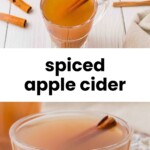 Clear glass mugs of spiced apple cider with cinnamon sticks on a white table, next to whole cinnamon sticks and an apple.