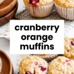 Three cranberry orange muffins in paper liners sit on a cooling rack next to a wooden plate, with the text “cranberry orange muffins” over the image.