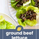 Three lettuce leaves topped with seasoned ground beef and sesame seeds are arranged on a plate. The text on the image reads “ground beef lettuce wraps” with a lemon graphic.
